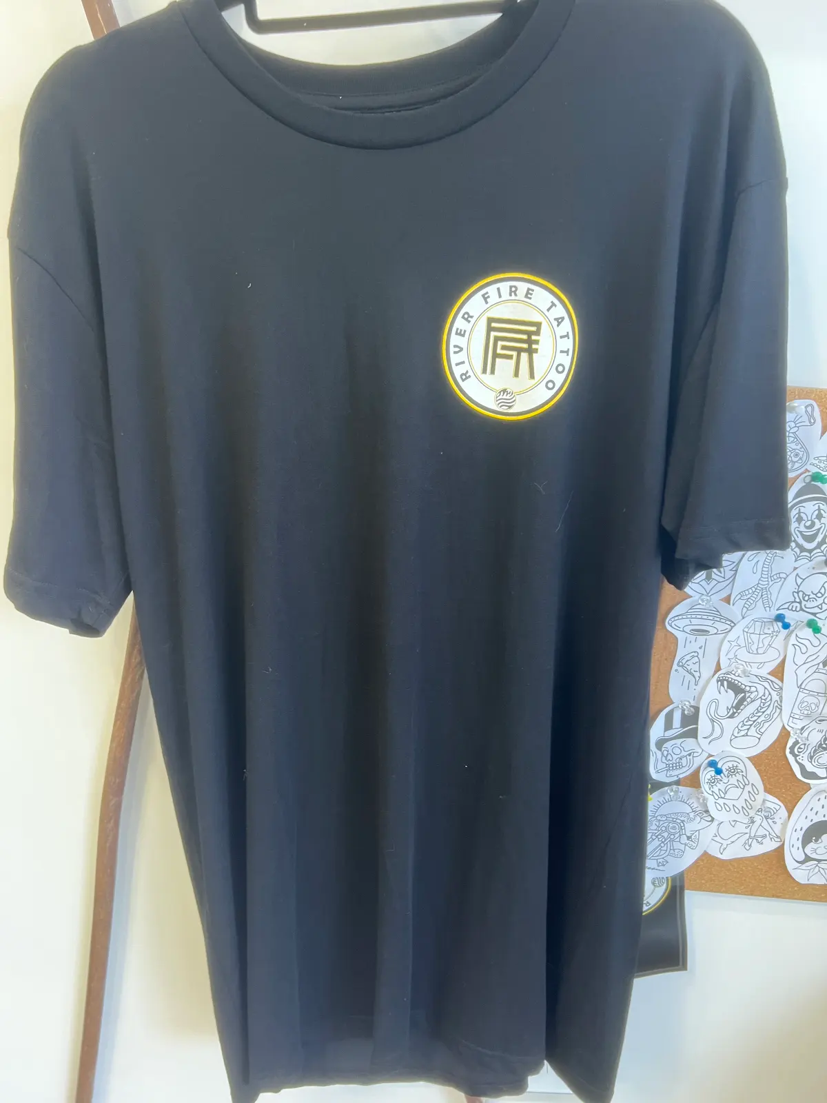 RFT Workers Support Tee, front — circular River Fire Tattoo emblem